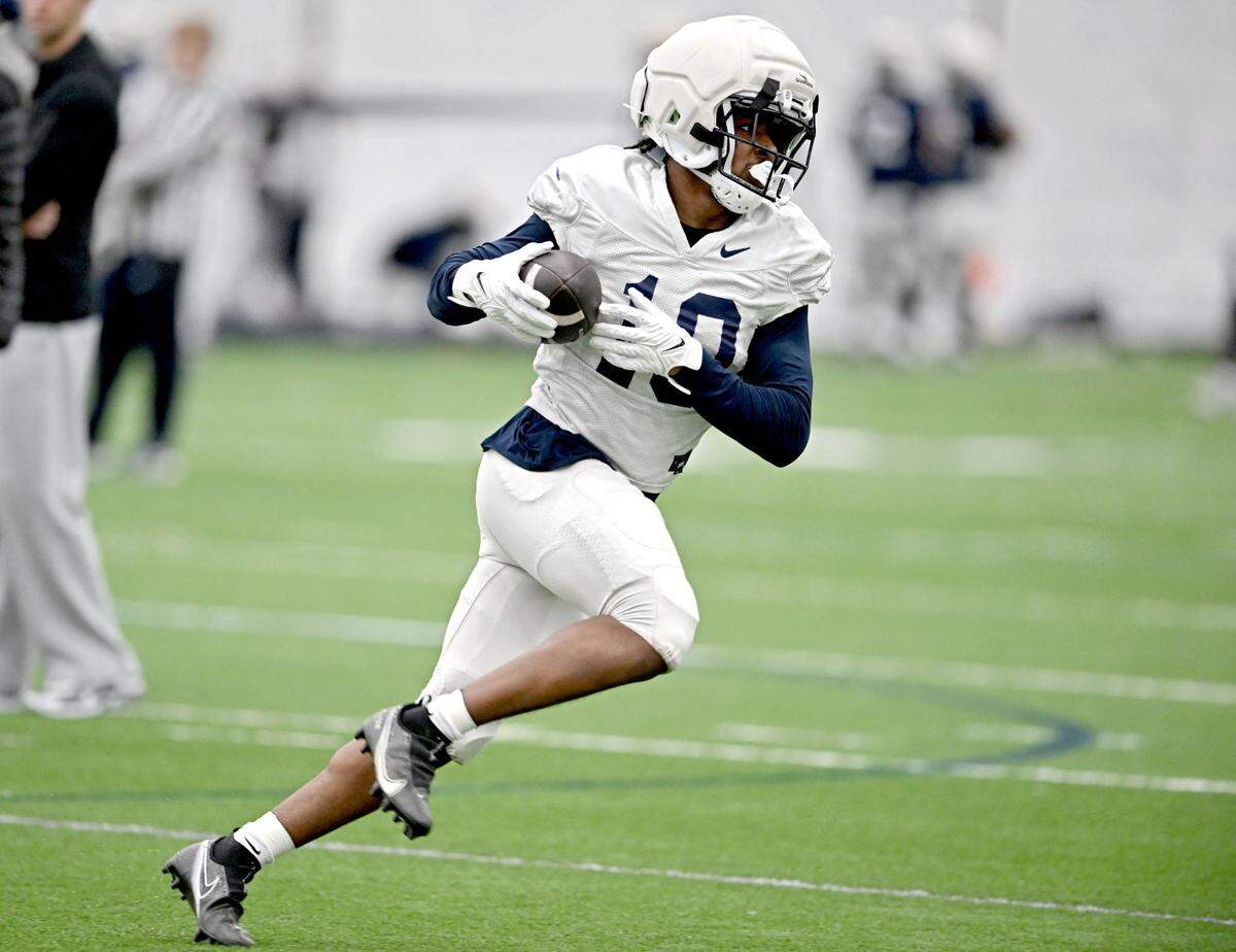 Penn State running back Nick Singleton runs with the ball during spring football practice on Tuesday, April 1, 2025.