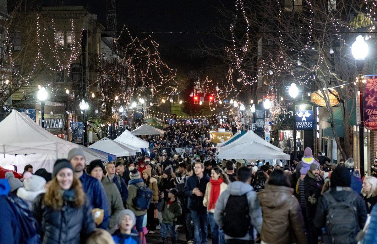 People fill Allen Street to see Santa and shop vendors during the State College Downtown Improvement Districts’ Light Up Night event on Thursday, Nov. 20, 2025. 