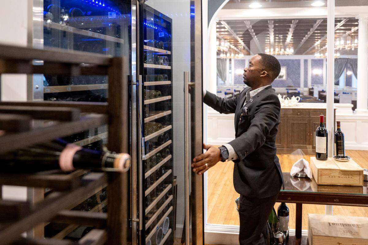 Richie Woodham, general manager in charge of wines at Lionne and 1855 Lounge in the Nittany Lion Inn, browses the inventory on Thursday, Feb. 20, 2025.