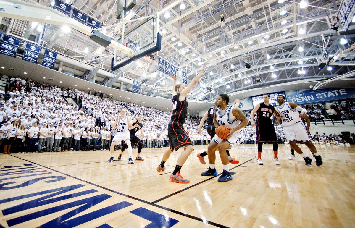 Penn State’s D.J. Newbill goes in for a basket past Princeton’s Hans Brase during the Return to Rec game on Saturday, December 14, 2013 at Rec Hall.