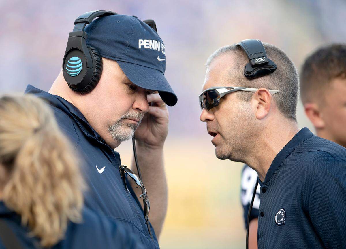 Penn State offensive line coach Matt Limegrover and special teams coordinator Phil Galiano talk during the Citrus bowl against Kentucky on Tuesday, Jan. 1, 2019 at Camping World Stadium.