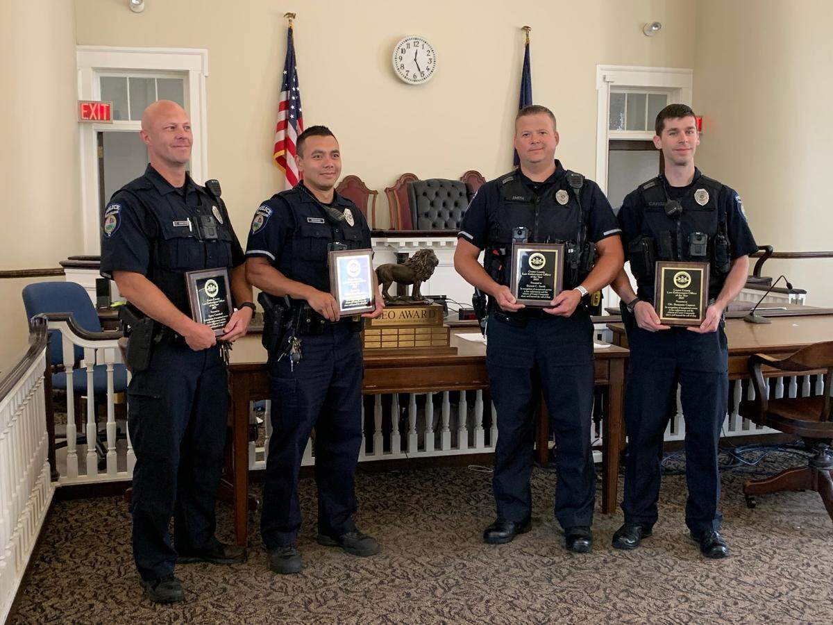 From left: State College police officer Larry Crawford, officer Dean Woodring, Lt. Barrett Smith and officer Ben Capozzi won a share of the Centre County Law Enforcement Officer of the Year award. Former borough police officer Cameron Earnest also won a share of the award.