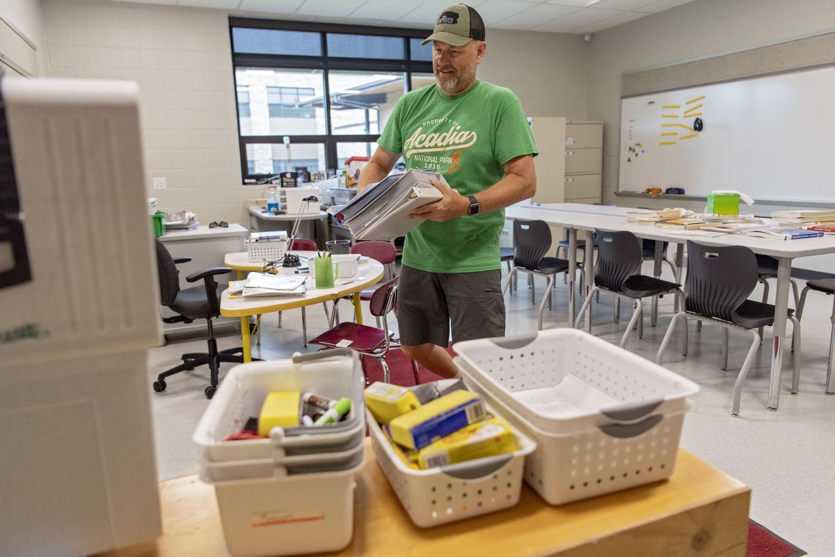 Reading specialist Chad Rockey sets up his new classroom in the Spring Creek Elementary School on Thursday, Aug. 15, 2019. As a specialist teacher, Rockey used to switch between Lemont Elementary and Houserville Elementary during the day.