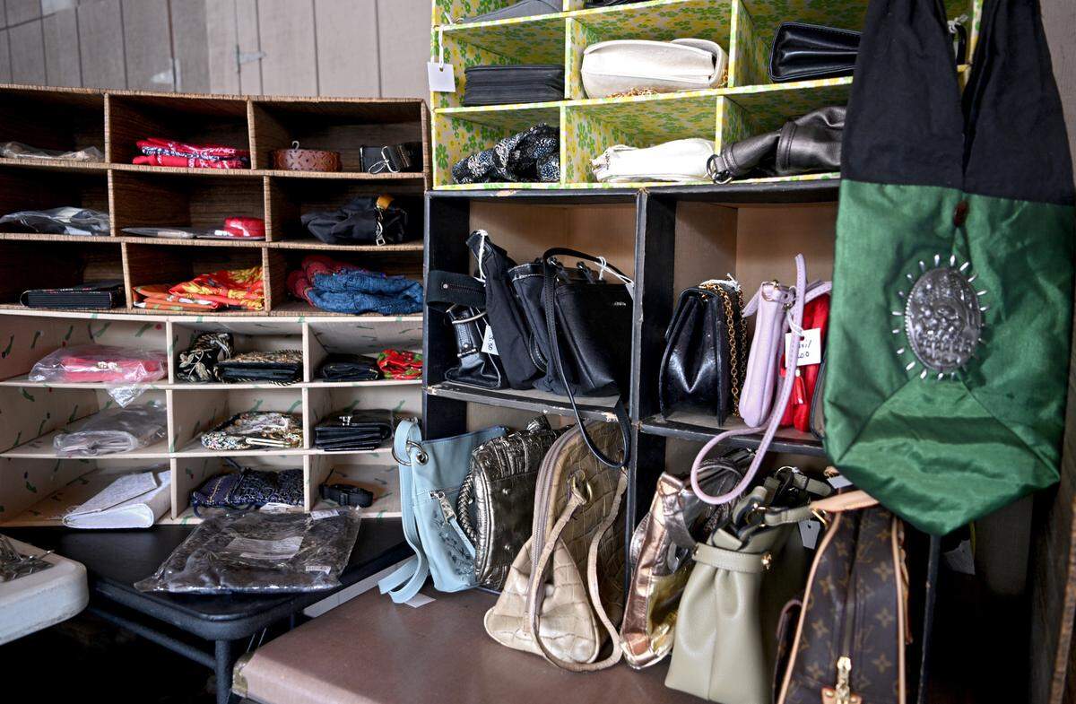 A variety of purses for sale at the Foxdale Village semi-annual garage sale.