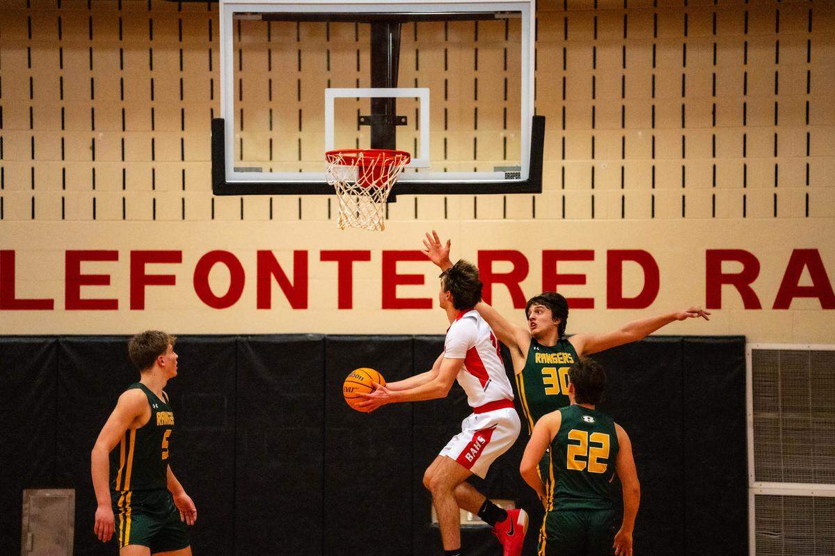 Bellefonte junior Daxton Kreiger (14) goes up for a contested layup during a game against Forest Hills at Bellefonte Area High School on Friday, Jan. 30, 2026. The Red Raiders Lost to the Rangers 69-41.
