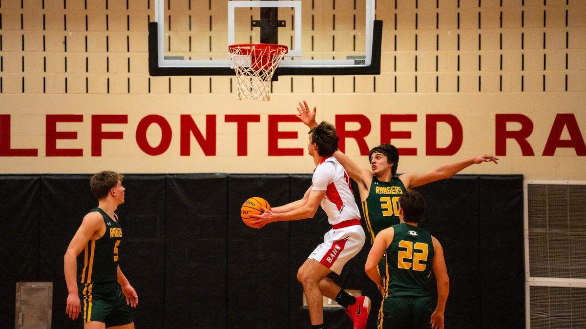 Bellefonte junior Daxton Kreiger (14) goes up for a contested layup during a game against Forest Hills at Bellefonte Area High School on Friday, Jan. 30, 2026. The Red Raiders Lost to the Rangers 69-41.