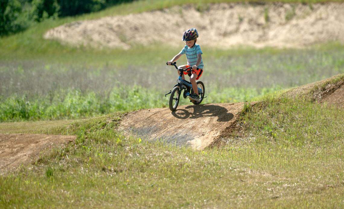 Benjamin Nollman, 4, tries out the new dirt pump track at Bernel Road Park on Tuesday, May 21, 2024.