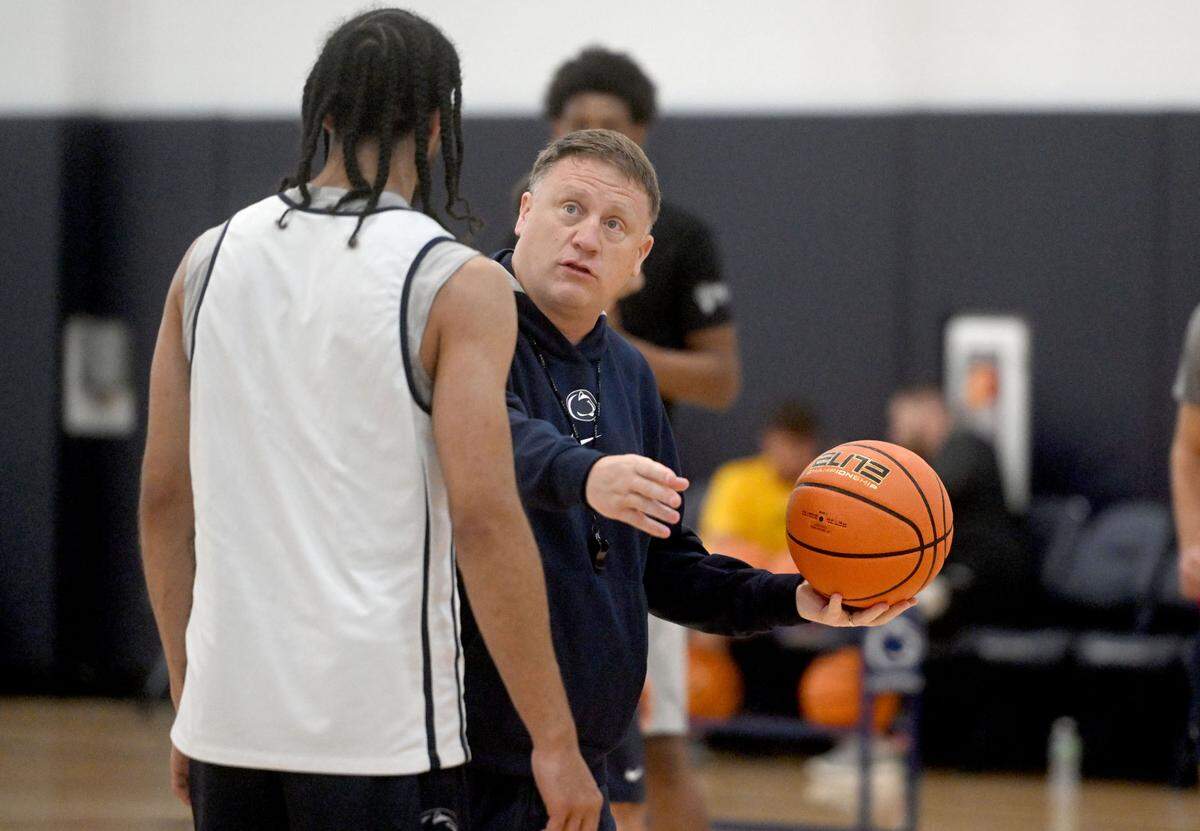 Penn State men’s basketball coach Mike Rhoades talks to Freddie Divine V during summer practice on Thursday, July 18, 2024.