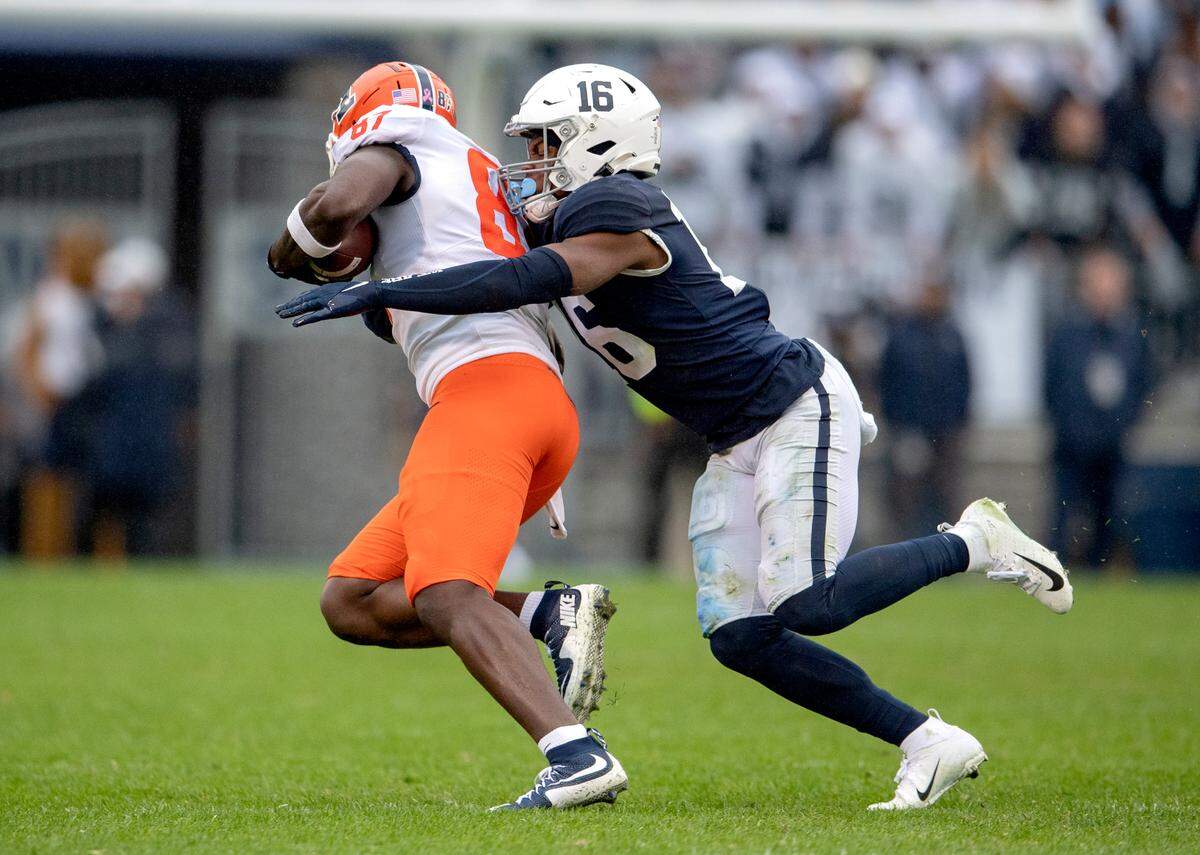 Penn State safety Ji’Ayir Brown stops Illinois tight-end Daniel Barker during the game on Saturday, Oct. 23, 2021.