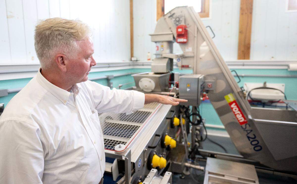 David Sterner talks about the automatic press he uses to make Laurel Spring Cider on Thursday, July 17, 2025.