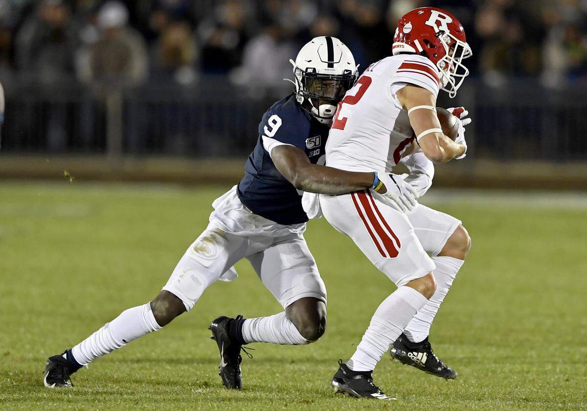 Penn State cornerback Joey Porter Jr. stops Rutgers ball carrier during the game on Saturday, Nov. 30, 2019.