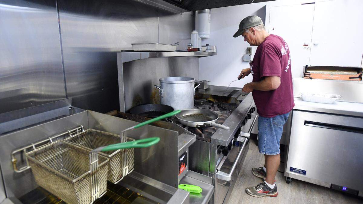 Greg Yearick, owner of The Express Casual Dining, prepares a cheesesteak Wednesday at the Centre Hall restaurant.