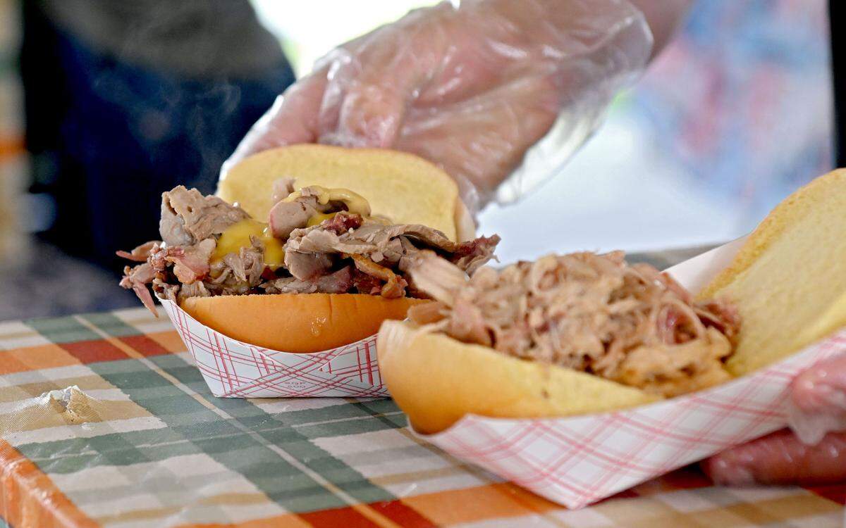 A beef and cheddar and pulled pork sandwich are served at the Pennsylvania Livestock Association stand at Penn State Ag Progress Days on Tuesday, August. 13, 2024.