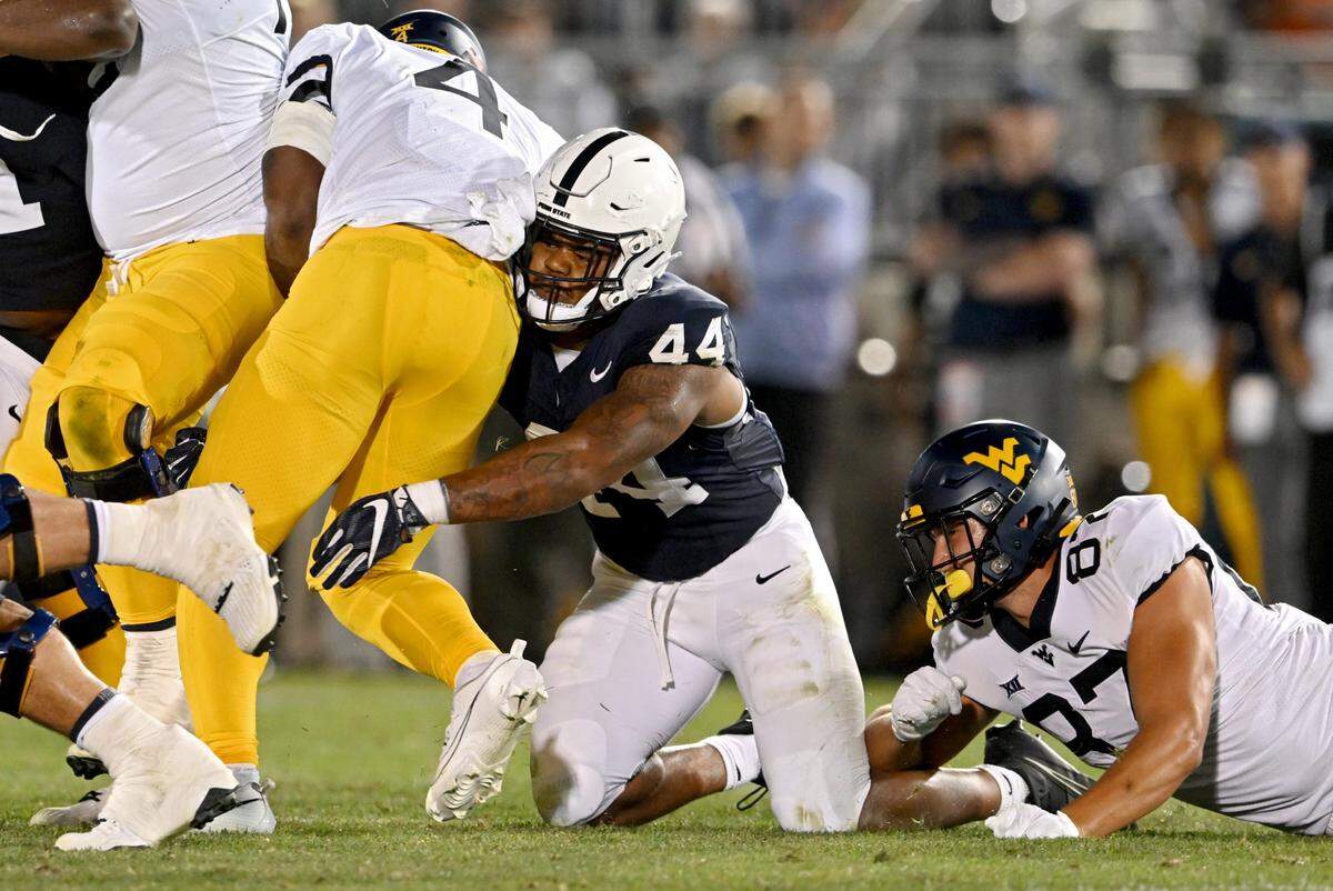 Penn State defensive end Chop Robinson stops West Virginia’s CJ Donaldson Jr during on Saturday, Sept. 2, 2023.