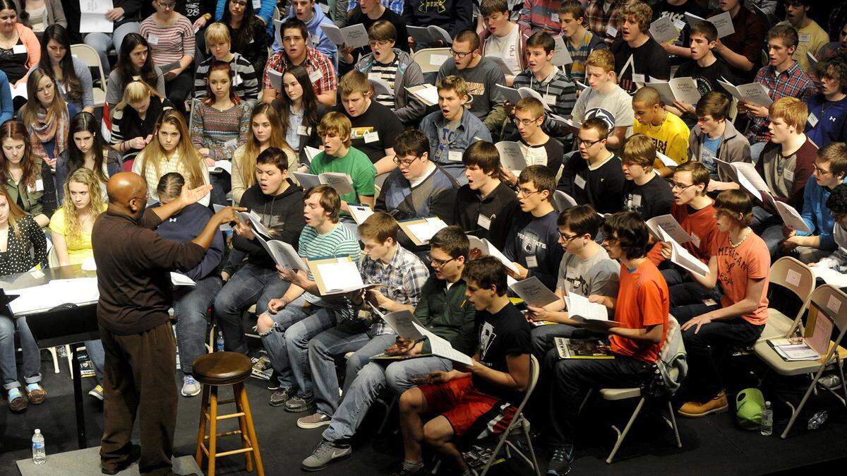 Anthony Leach, a professor of music at Penn State, directs the PMEA District 4 Chorus at Bellefonte Area High School in January 2014. Leach died Wednesday at 73 years old.