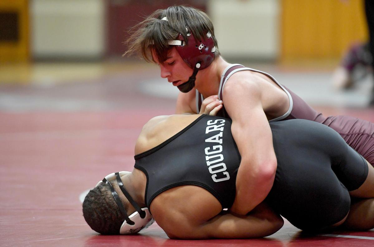 State College’s Clayton Leidy controls Harrisburg’s Devon Johnson in the 138 lb bout during the match on Tuesday, Dec. 17, 2019. Weaverling won by fall in 28 seconds.