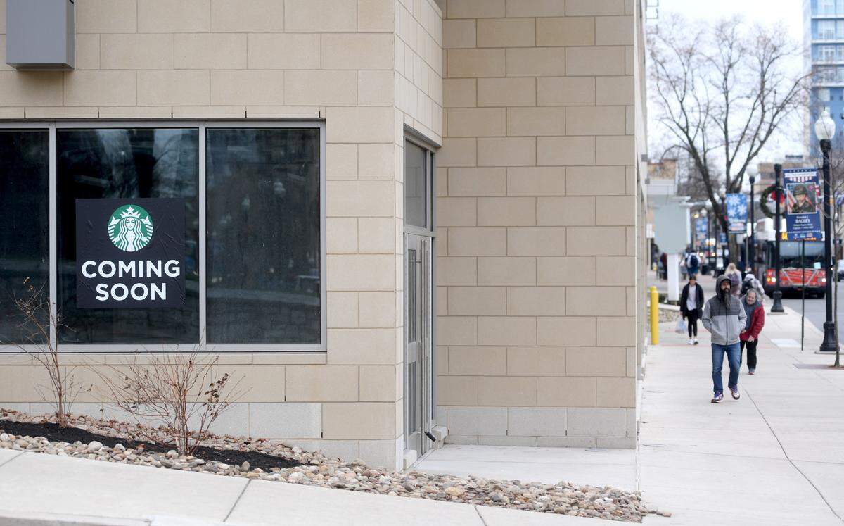 A Starbucks sign is in the window of retail space at the Pugh Center on the corner of Beaver Avenue and Pugh Street in downtown State College.