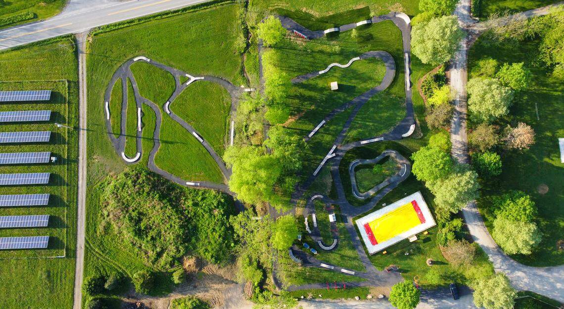 An aerial view of the Bellefonte KOA bike park, including the jumping pillow and hammocks.