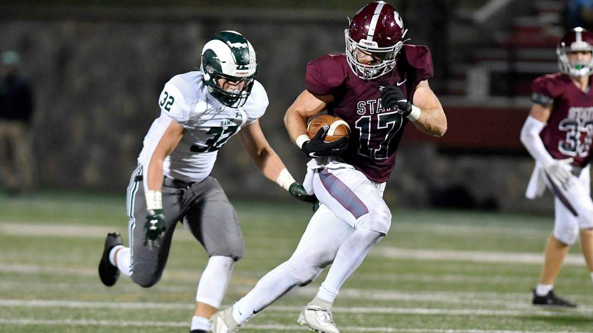 State College’s Kyle Kurzinger runs down the field ahead of Central Dauphin defenders for a touchdown in the second quarter of the game on Friday, Oct. 1, 2021 at Memorial Field.