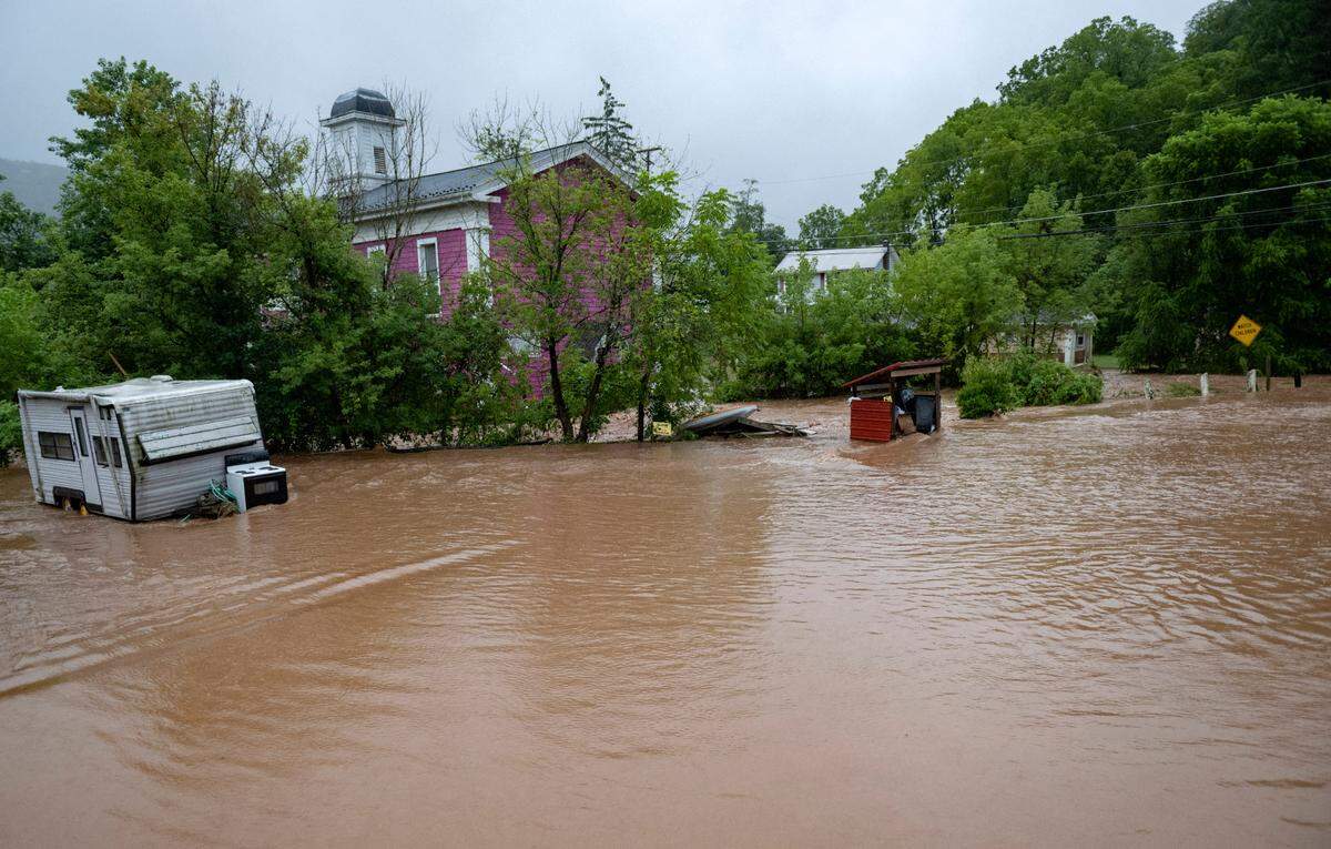 Dewitt Run overflows its banks and floods several homes in Unionville on Friday, August. 9, 2024.