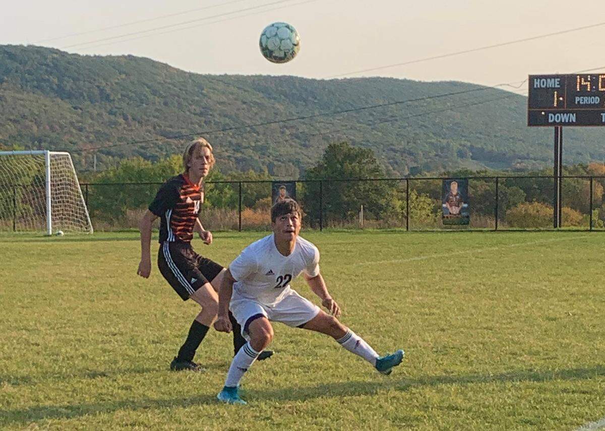 IPenns Valley senior forward Michael Johnson and Tyrone defender Brendan Andrews battle for the ball during their match at Tyrone on Tuesday, Oct. 6.
