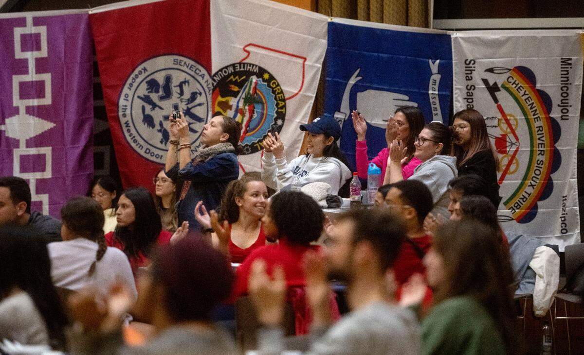 The crowd claps along and takes photo of Las Cafeteras during the Indigenous Peoples Day Feast on Monday, Oct. 9, 2023 at the HUB Robeson Center on the Penn State campus.
