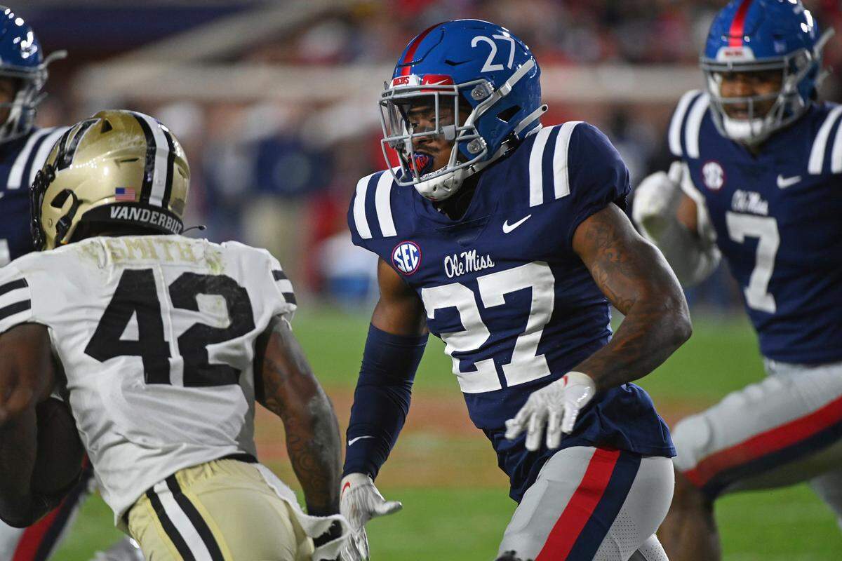Ole Miss’ Tysheem Johnson (27) pressures Vanderbilt running back Patrick Smith (42) during the first half of game in Oxford, Miss., on Nov. 20, 2021. Johnson is from Philadelphia.
