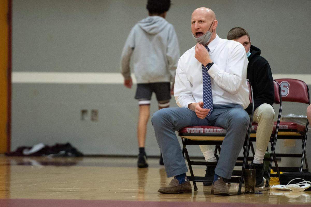 State High head coach Ryan Cummins yells to his wrestler during a PIAA wrestling bout between State High and Williamsport at State High gym on Monday Jan. 31, 2022 in State College, Pa.
