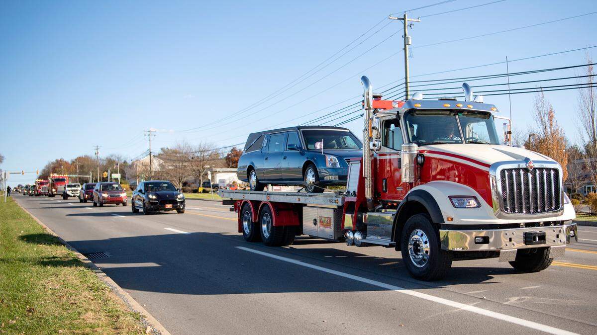 A procession of tow trucks and emergency vehicles honors the life of Jim Corl, the owner of Valley Truck and Trailer, after his funeral on Friday.