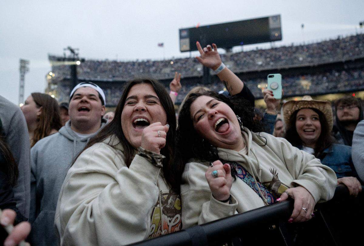 Fans sing along to Jordan Davis as he performs at Beaver Stadium before Luke Combs on Saturday, April 27, 2024.
