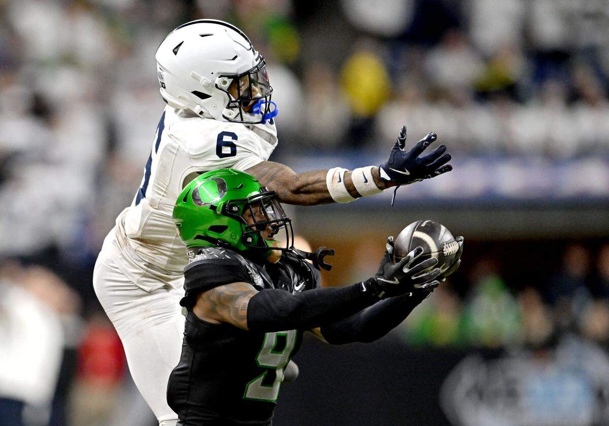 Oregon’s Nikko Reed intercepts the ball intended for Penn State wide receiver Harrison Wallace III during the Big Ten Championship game at Lucas Oil Stadium on Saturday, Dec. 7, 2024.