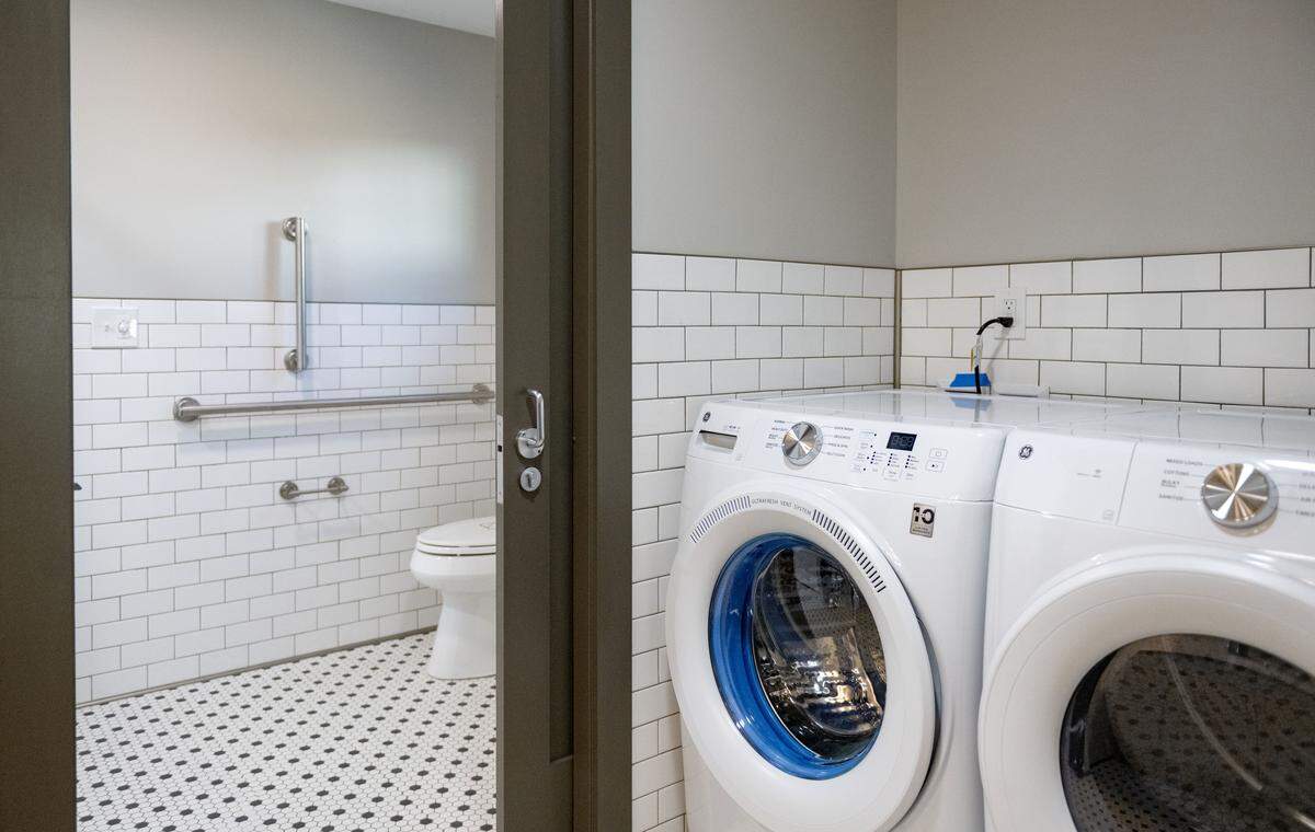 The laundry area and bathroom in the ADA accessible apartment at the Old Boalsburg Road Flats in State College. The energy-efficient apartments were a collaboration between the State College Borough, the State College Community Land Trust and the HOME Foundation. 