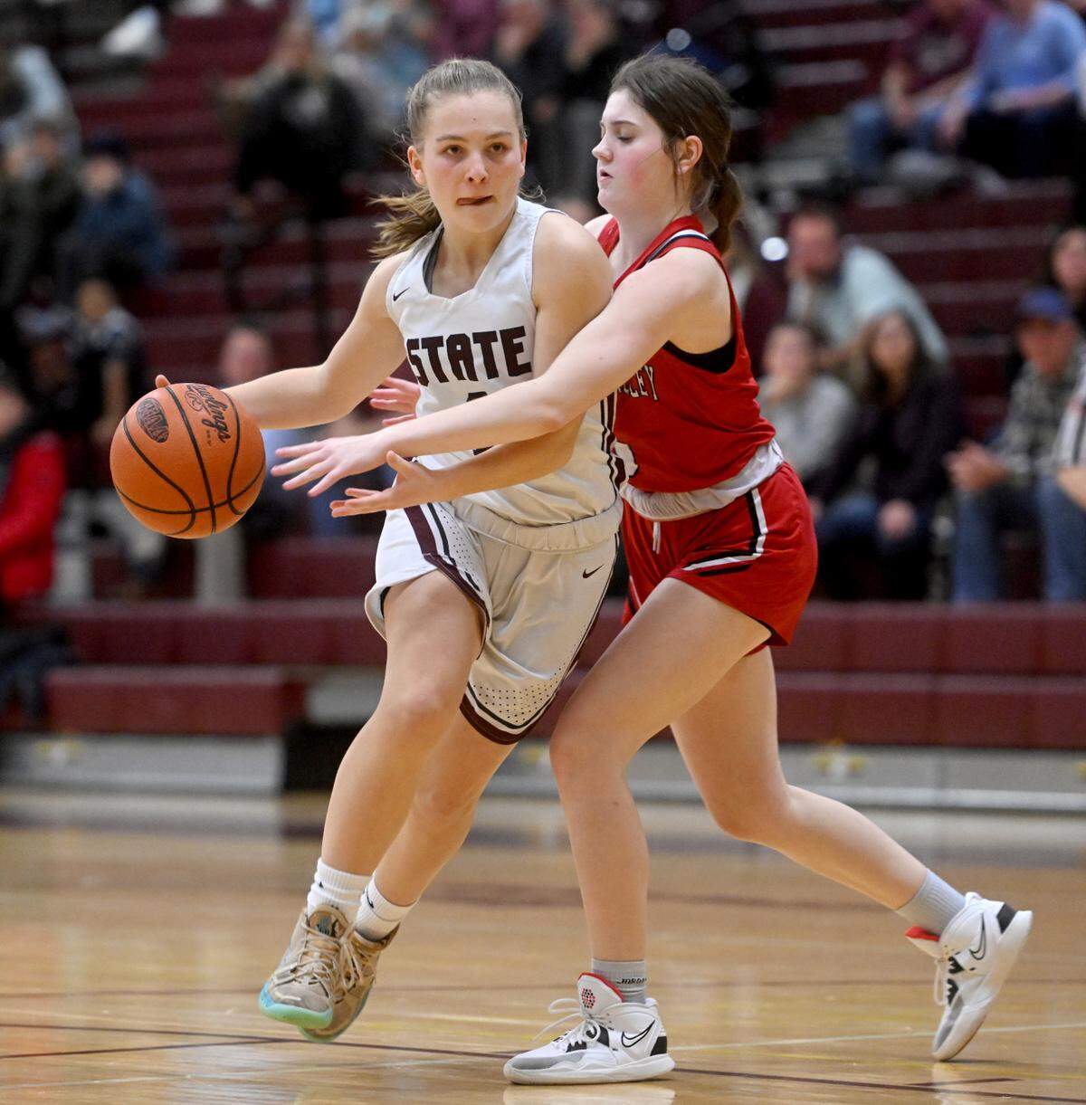 State College’s Jess Hawbaker dribbles around a Cumberland Valley defender during the game on Tuesday, Jan, 24, 2023.