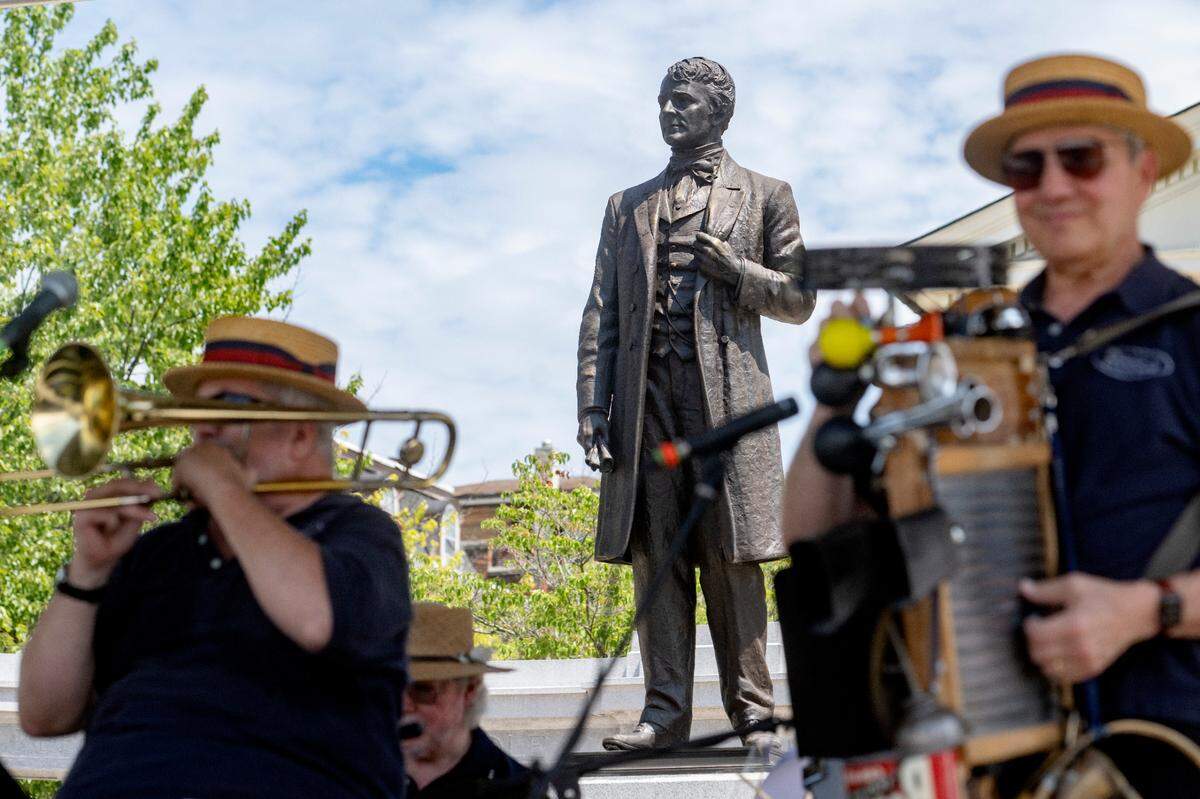 The statue of Andrew G. Curtin is the backdrop as the Deacons of Dixieland entertain the crowd during the 39th Annual Bellefonte Arts and Crafts Fair on Friday, Aug. 5, 2022.