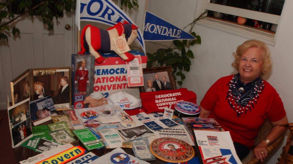 Ruth Rudy, who was a delegate to the Democratic Convention, poses in July 2004 with some the political memorabilia she has collected since her first convention in 1972. Rudy died on March 28.