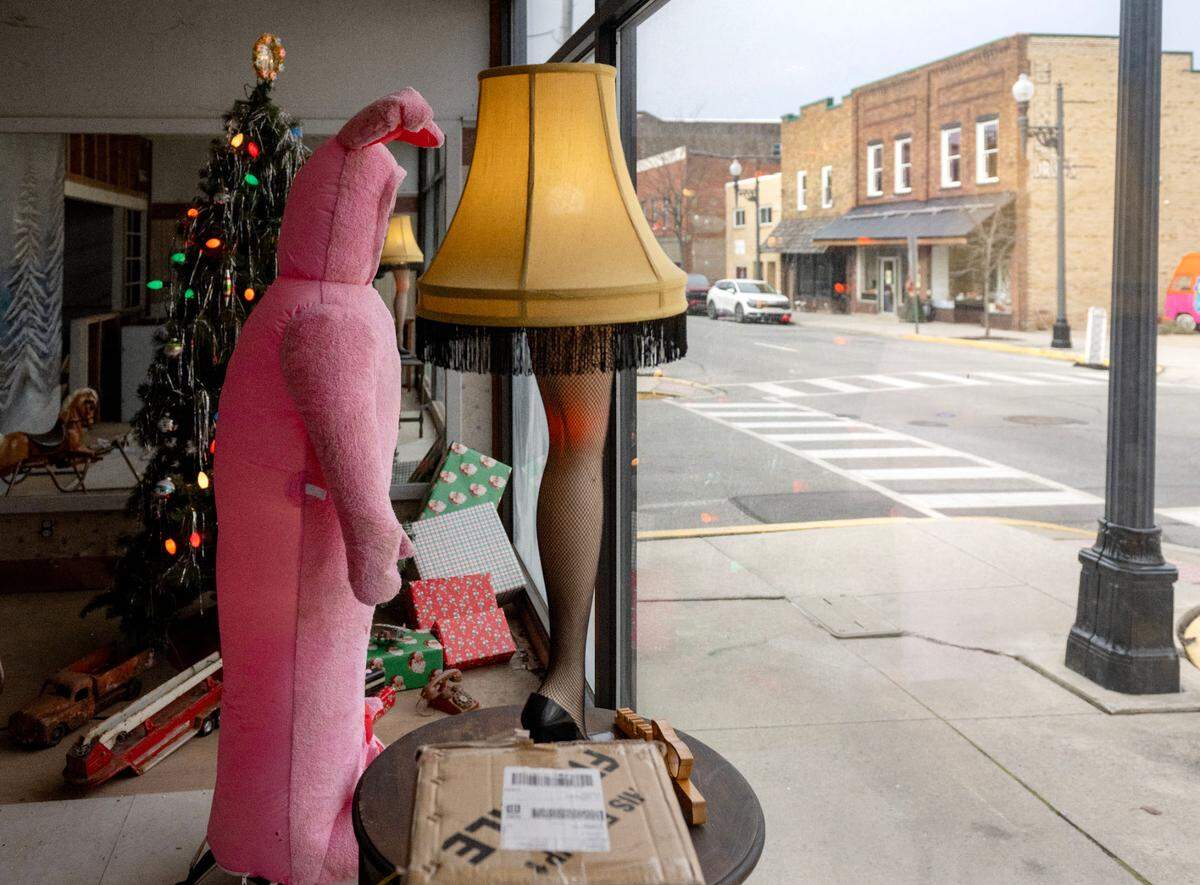 “A Christmas Story” themed window display featuring a leg lamp and an inflatable Ralphie is pictured on North Front Street, where storefronts are decorated for Philipsburg’s Mid-Century Christmas.