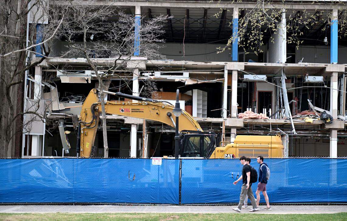 Students walk by portions of the Sackett Building on Monday, March 31, 2025.