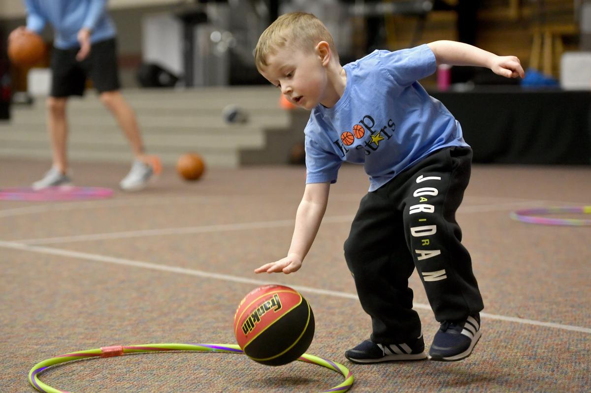 Nelson Stager, 3, dribbles a basketball during a Hoops Stars class on March 4 at Park Forest Baptist Church.