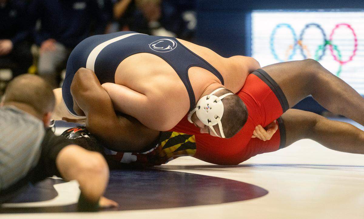 Penn State’s Seth Nevills rolls Maryland’s Jordan Gabriel for the pin in the 285 lb bout of the match on Sunday, Feb. 12, 2023 at Rec Hall.