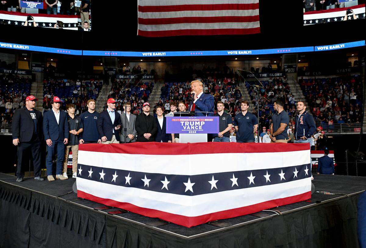 Donald Trump brings former and current Penn State wrestlers to the stage during his rally at the Bryce Jordan Center on Saturday, Oct. 26, 2024.