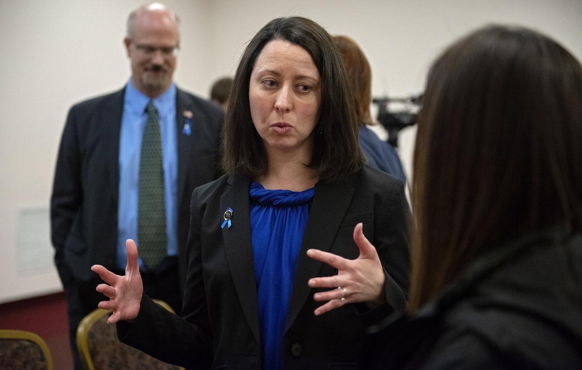 Christine Bishop, chief executive officer for the Centre County Youth and Service Bureau, chats with others after a discussion for sexual assault awareness month and child abuse prevention month at the Ramada Inn on Monday, April 1, 2019.