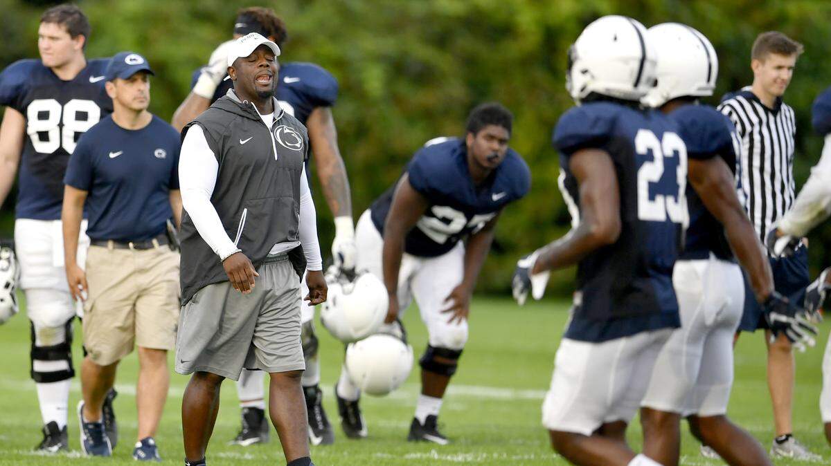 Penn State defensive line coach Sean Spencer yells to his players during practice last August. Spencer helped pick up his third DE commit of the 2019 class Friday with a pledge from 3-star Smith Vilbert from New Jersey.