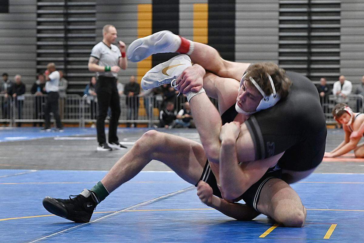 Penn State’s Bernie Truax scrambles with Purdue’s James Rowley in their 184-pound match of the Journeymen Collegiate Classic on Sunday at Freedom High School in Bethlehem. Truax began his Nittany Lions career with a 7-4 win over Rowley.