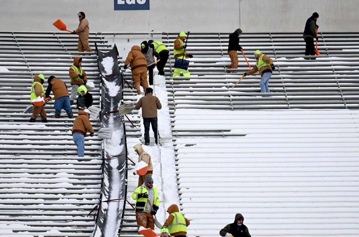 Crews shovel the snow from the stands at Beaver Stadium on Wednesday, Jan. 28, 2026.  