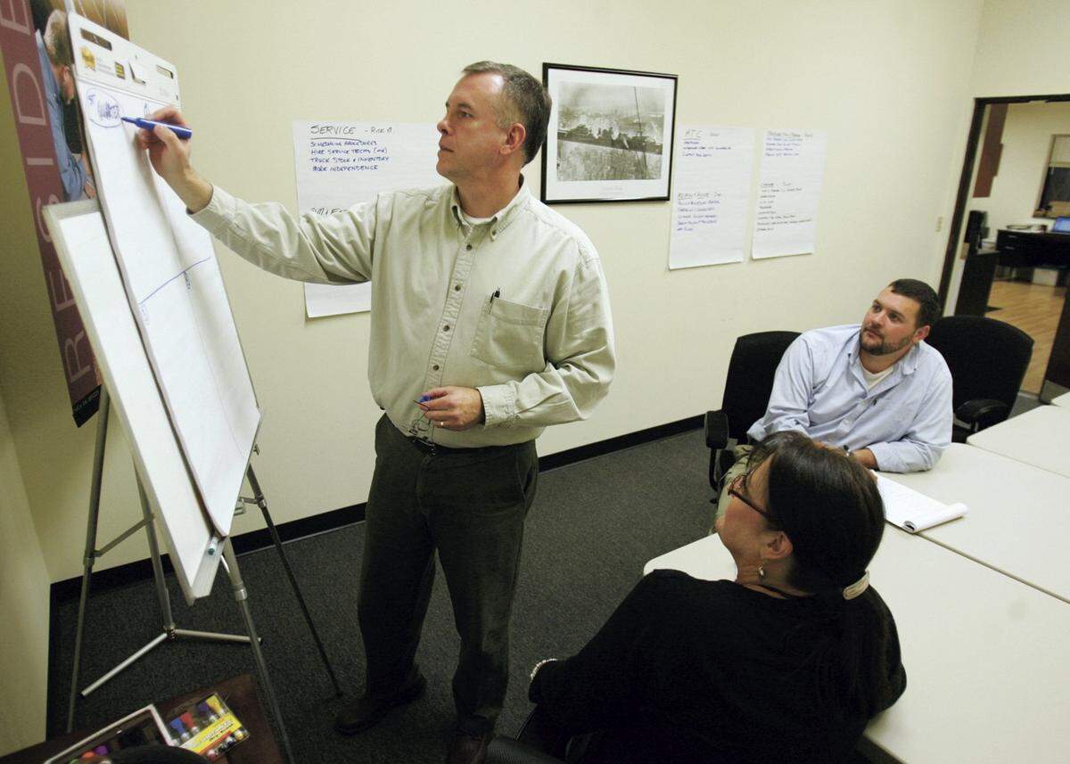 Goodco Mechanical owner Scott Good, left, at the company’s offices in State College on November 19, 2009.