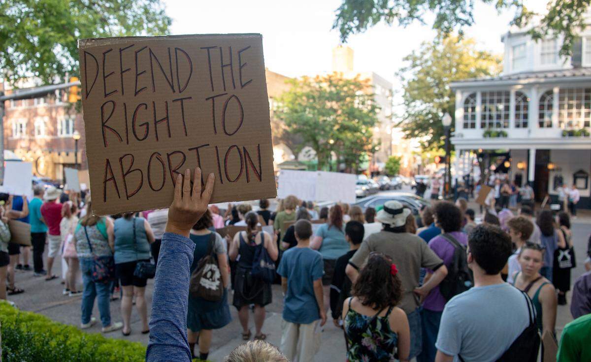 Hundreds of people gathered at the Allen Street Gates in downtown State College Friday to protest the U.S. Supreme Court overturning Roe v. Wade.