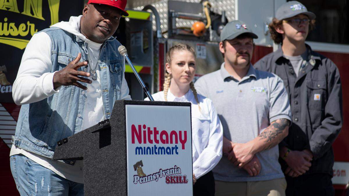 Former NFL and Penn State football player LaVar Arrington speaks Friday during an event at the Nittany Minitmart office in State College. Nittany Minitmart and Pennsylvania Skill are raise money for volunteer firefighters in Pennsylvania.
