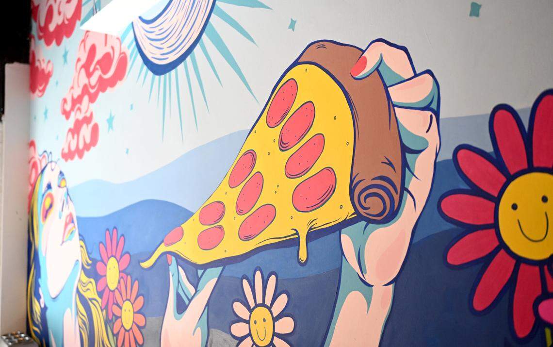 A mural painted by Carson Arnold covers the wall at Benny Leone’s at 109 S. Fraser St. in downtown State College.