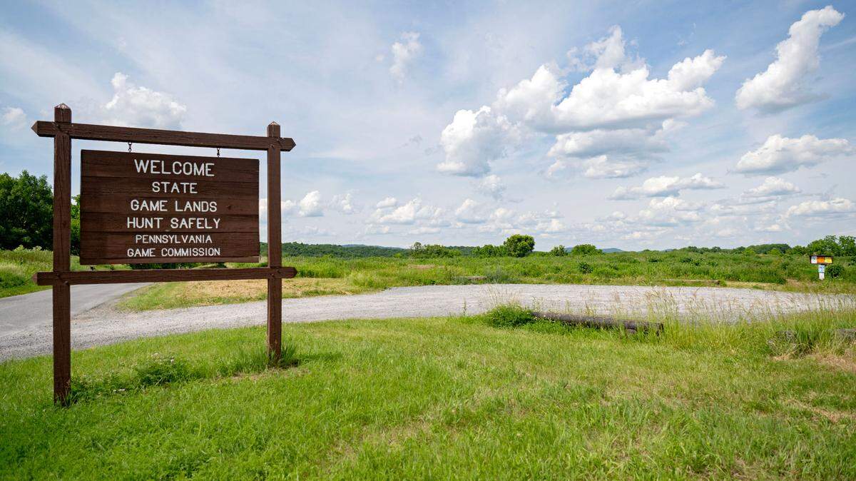 A sign and the parking area for the state game lands along Shiloh Road where a new Pennsylvania Game Commission regional office is proposed.