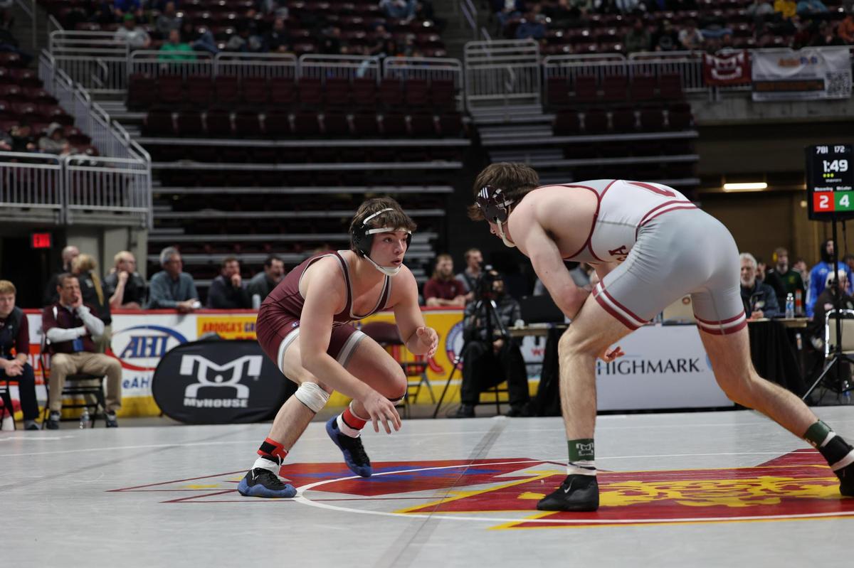State College’s Carter Weaverling looks for an opening on Conestoga’s Hayden McLellan in their 172-pound consolation second round match of the PIAA Class 3A Championships on Friday, March 10, 2023 at the Giant Center in Hershey. McLellan edged Weaverling, 10-8, in sudden victory.